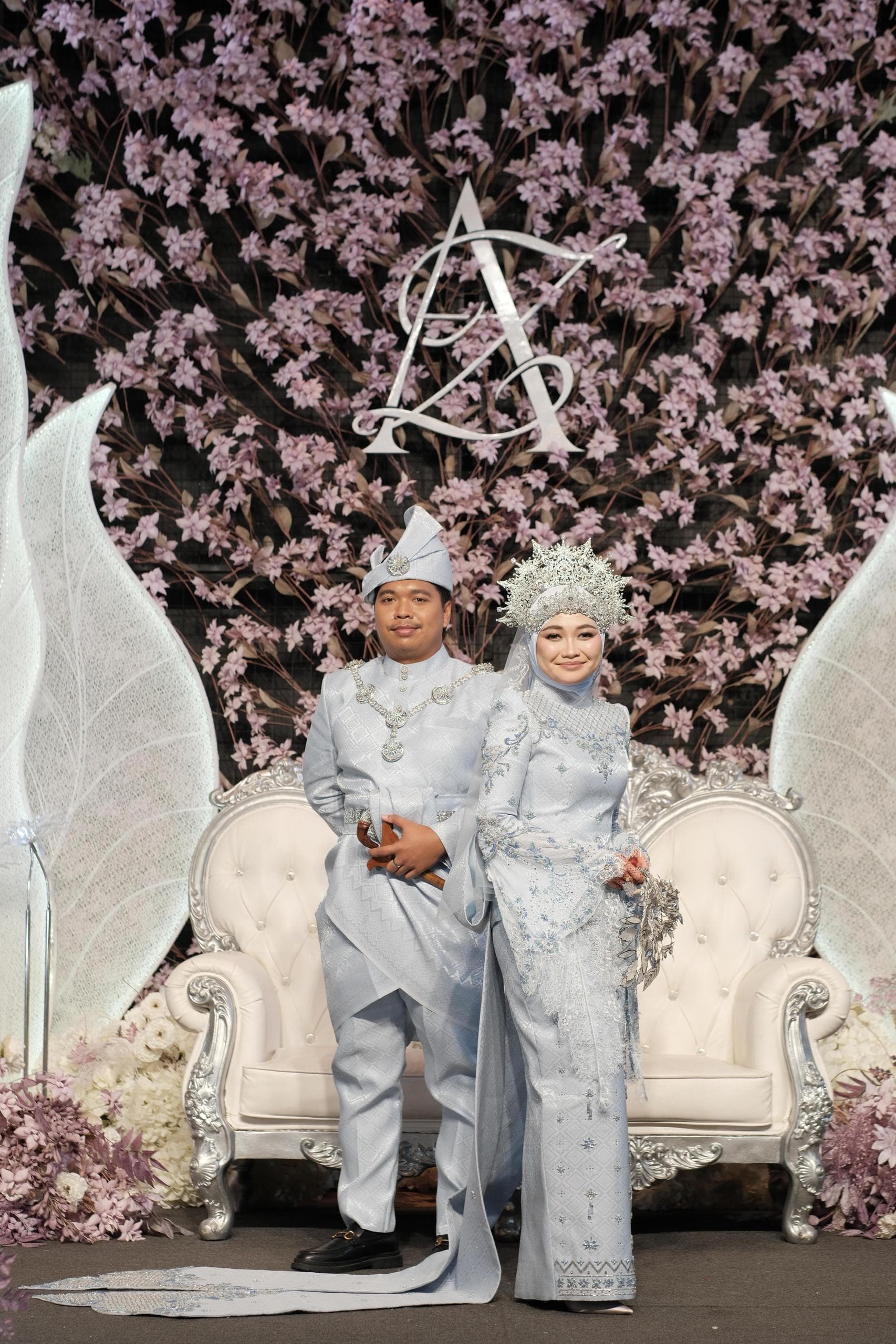 on their wedding day wearing Warna Asmara